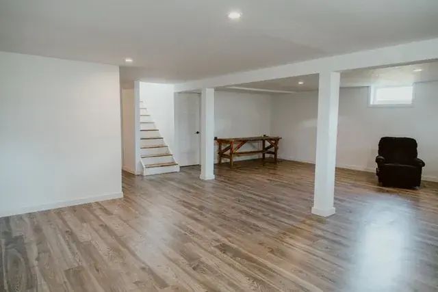 Finished Red Deer basement with new stairs, flooring and trim