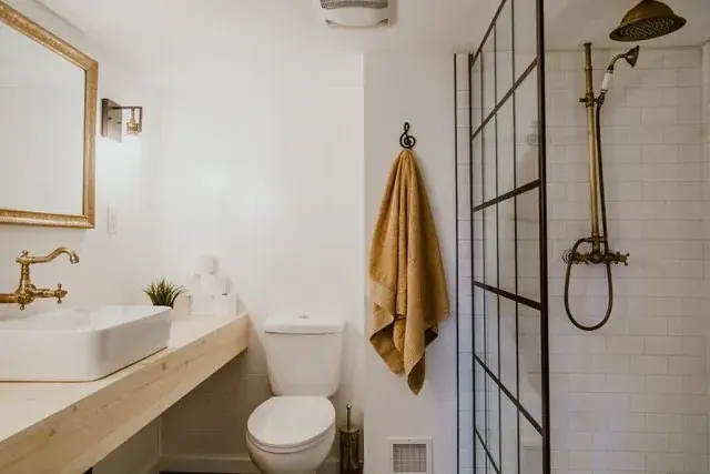 Renovated Red Deer bathroom with a tiled shower, glass screen and floating vanity