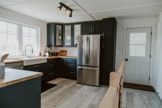 Renovated Red Deer kitchen with new cabinets, counters and range wall