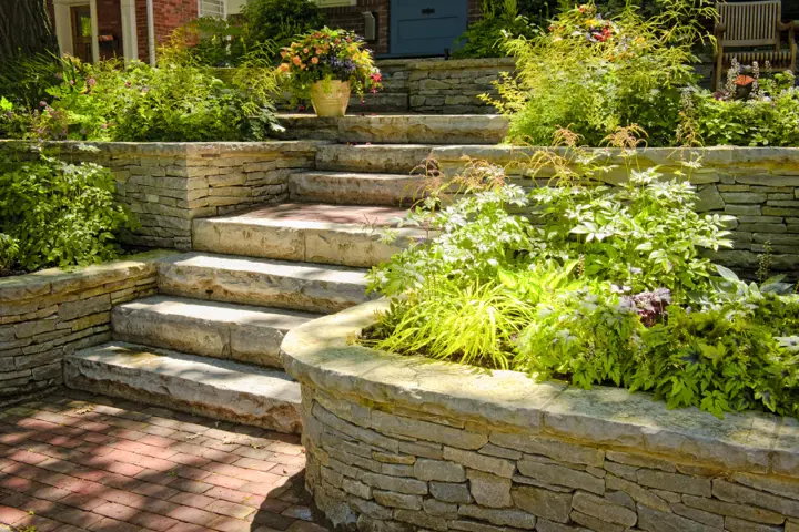 Retaining wall construction Red Deer Alberta - concrete block and natural stone