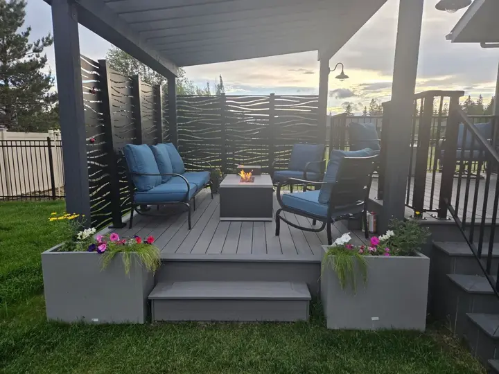 Custom pressure treated pergola with Sunbelly aluminum privacy screens over a TimberTech Prime+ composite deck in Red Deer, AB - built by Green Ladder Contractors